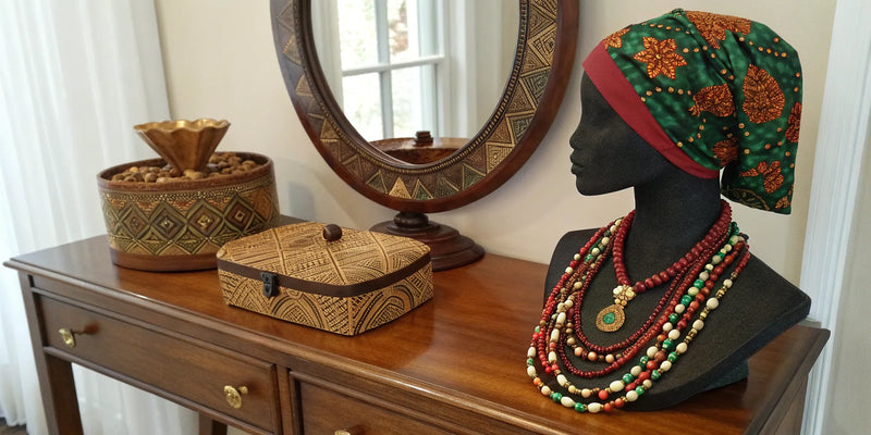 A selection of Afrocentric gifts for her, including unique jewelry and cultural decor.