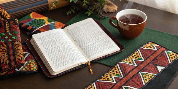 Vibrant Afrocentric Bible organizer with an open Bible on a table for faith study.