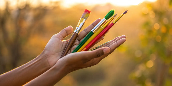 Art fundraising: Colorful paintbrushes symbolize creative support.