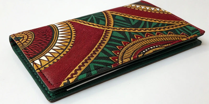 Durable Afrocentric checkbook cover featuring bold red, green, and gold cultural patterns.