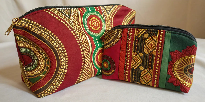 Afrocentric cosmetic bag set with red, green, and gold patterns.