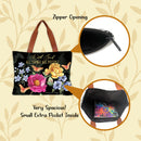 Floral tote bag with zipper opening and extra pocket on a decorative background